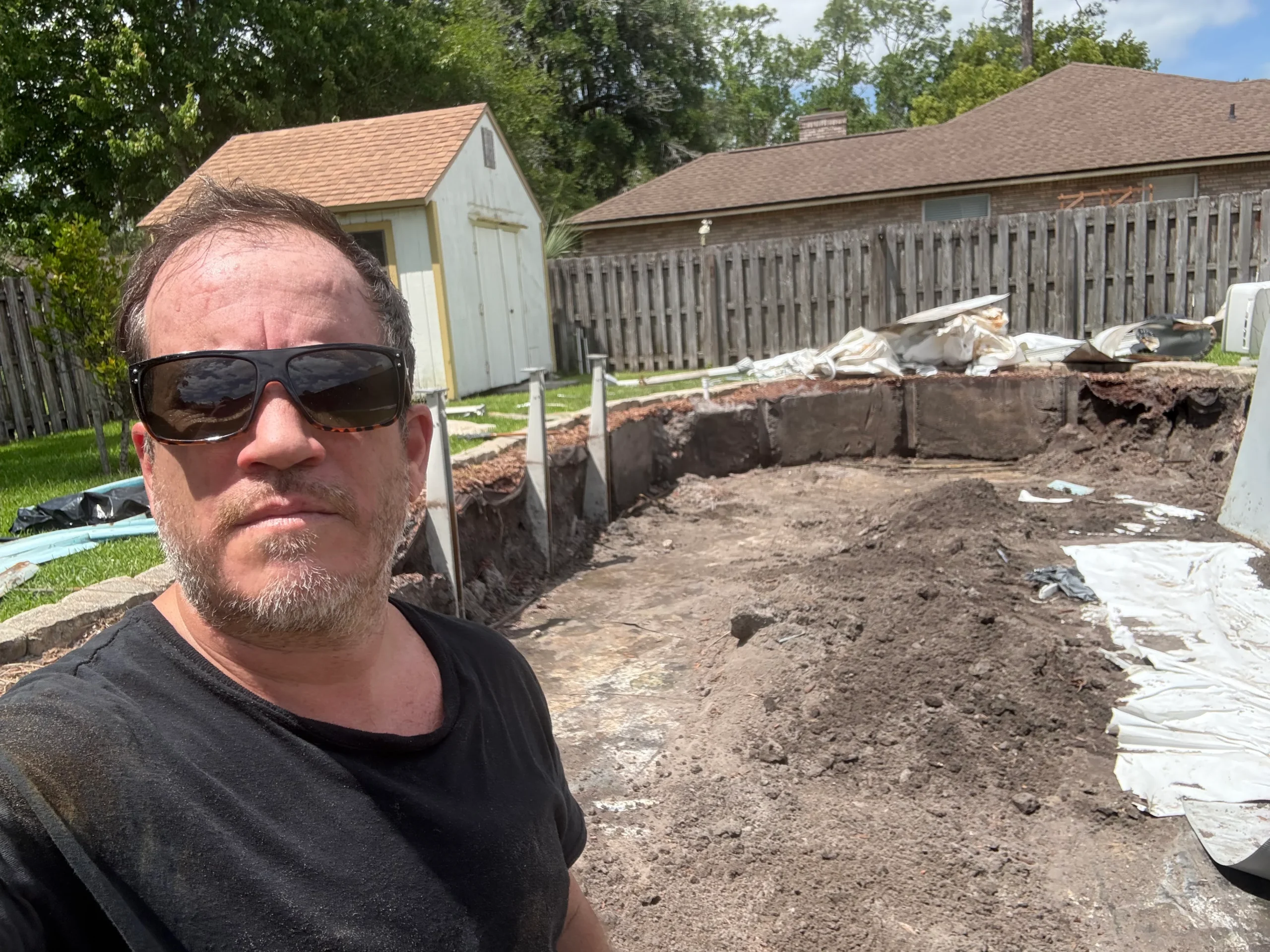 Arturo Leon, owner of Emergency Junk LLC, at a backyard debris removal job in St. Augustine, FL